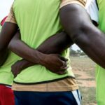 back-view-football-players_23-2148905583
