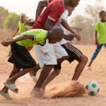 childrens-playing-football_23-2148917947