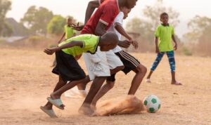 childrens-playing-football_23-2148917947